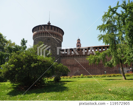 The exterior walls of Castello Sforzesco seen through the trees (Milan, Italy) 119572905