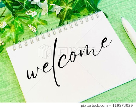 A note with the word welcome written on it 119573029