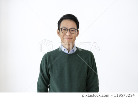 A man in his 40s smiling at the camera A man in his 40s smiling at the camera 119573254