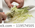 Shredding cabbage with a knife 119574505
