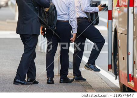 Male commuter boarding a bus 119574647