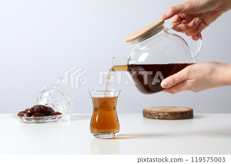 Turkish tea in a transparent glass teapot Turkish tea in a transparent glass teapot 119575003