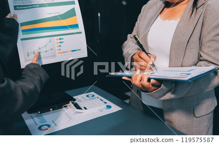Business people are analyzing and planning business strategies. 119575587