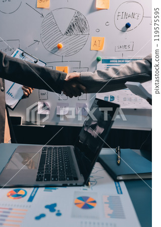 Business handshake for teamwork of business merger and acquisition,successful negotiate,hand shake,two businessman shake hand with partner to celebration partnership and business deal concept 119575595