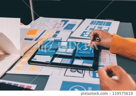 The designer team is designing the uxui system to make the uxui system work well on new phones and support system updates. Website development concept UI UX front end designer 119575619