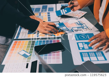 The designer team is designing the uxui system to make the uxui system work well on new phones and support system updates. Website development concept UI UX front end designer The designer team is designing the uxui system to make the uxui system work well on new phones and support system updates. Website development concept UI UX front end designer 119575623