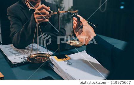 Judge gavel with Justice lawyers having team meeting at law firm background. Concepts of Law and Legal services. 119575667