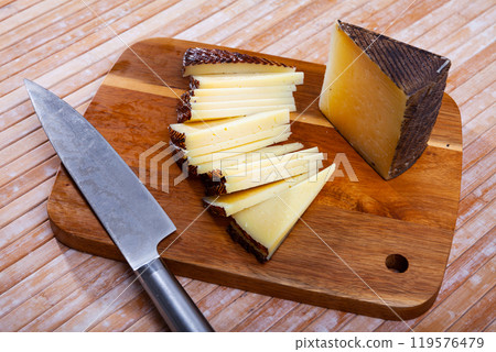 Sliced italian cured sheep cheese Pecorino Sliced italian cured sheep cheese Pecorino 119576479