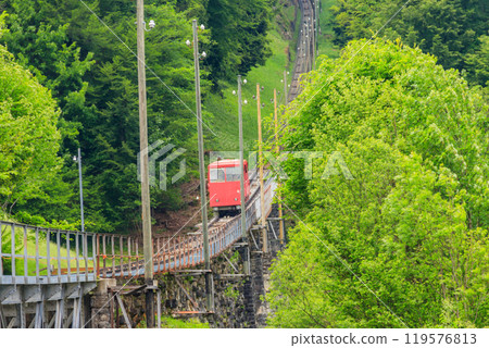 Red funicular to Niesen mountain in Switzerland Red funicular to Niesen mountain in Switzerland 119576813