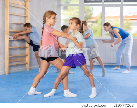 young athletes train tirelessly young athletes train tirelessly 119577268