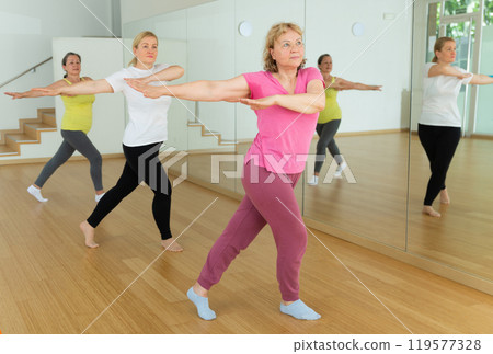 Mature women training at group dance class 119577328