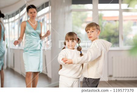 Boy with pair girl in sport wear train to dance contemporary vigorous hustle during classes. 119577370