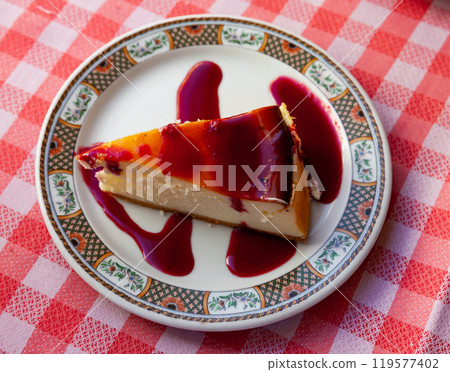 Slice of delicious cheesecake with berries jam Slice of delicious cheesecake with berries jam 119577402