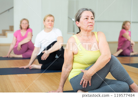 Ladies are doing lord of the fishes pose 119577484