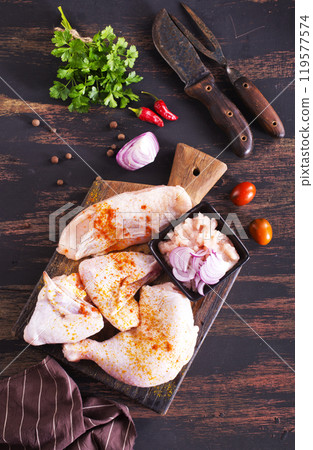 fresh chicken meat on a wooden table 119577574