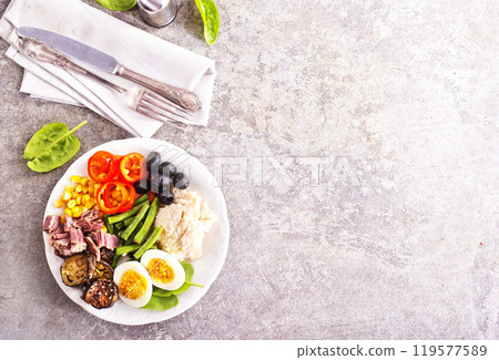 breakfast with boiled eggs, meat and vegetables 119577589