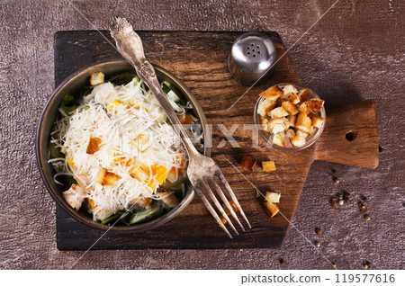 Sauerkraut in a bowl closeup. Fermented food. Cabbage salad with carrots. 119577616