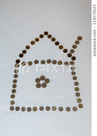 House made of coins standing on white background 119578525
