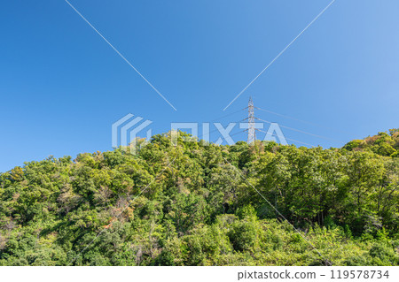 Mountain with a steel tower in Katano City, Osaka Prefecture 119578734