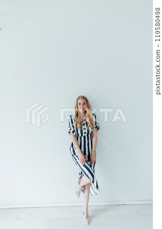 Portrait of Beautiful Fashion Blonde Woman in Striped Summer Dress Portrait of Beautiful Fashion Blonde Woman in Striped Summer Dress 119580498