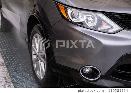 SUV Being Washed at Car Wash SUV Being Washed at Car Wash 119581354