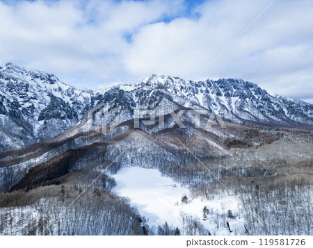 Kagamiike Pond and the Togakushi mountain range in winter (drone aerial photography) Togakushi, Nagano City, Nagano Prefecture 119581726