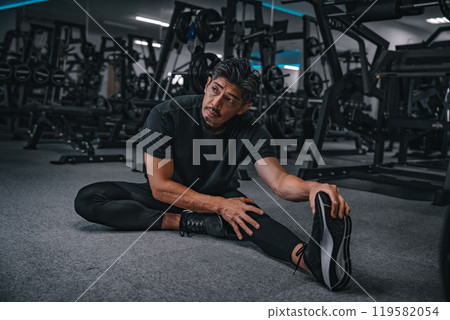 man stretching at the gym man stretching at the gym 119582054