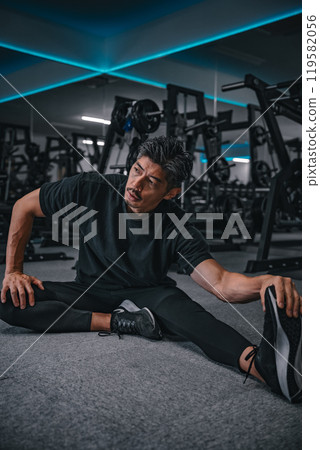 man stretching at the gym man stretching at the gym 119582056