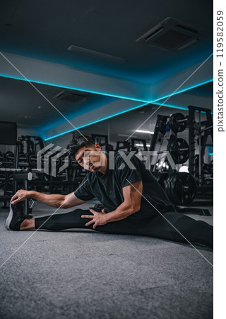 man stretching at the gym man stretching at the gym 119582059