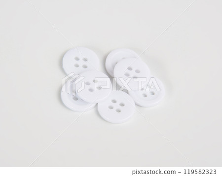 White bright cloth buttons on the white background 119582323