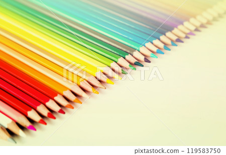 Colored pencils lying in row 119583750