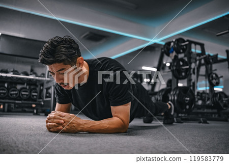 Man doing core training at the gym Man doing core training at the gym 119583779