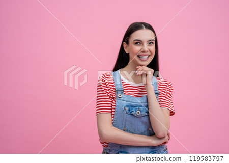 Happy young woman in striped tshirt looking contented 119583797
