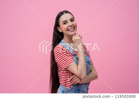 Happy young woman in striped tshirt looking contented Happy young woman in striped tshirt looking contented 119583800