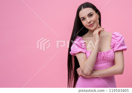 Pretty young long-haired woman in pink dress looking dreamy Pretty young long-haired woman in pink dress looking dreamy 119583805