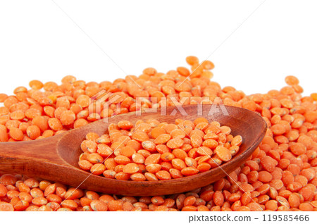 Red lentil in spoon isolated on the white background Red lentil in spoon isolated on the white background 119585466