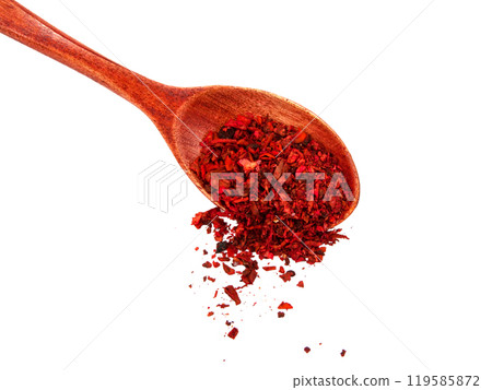 Dried tomato and paprika spice in wooden spoon isolated on the white background 119585872
