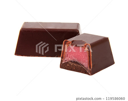 Chocolate sweets with pink strawberry filling praline isolated on the white Chocolate sweets with pink strawberry filling praline isolated on the white 119586060