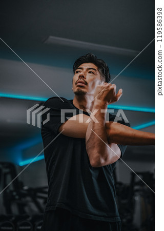 man stretching at the gym man stretching at the gym 119586398