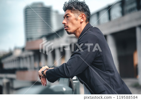 A man looking serious on a bridge 119588584