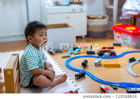 A 2-year-old boy playing with Plarail 119588624