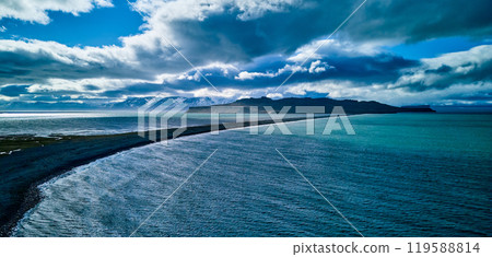 Spectacular coastline and snowy mountain scenery in Iceland Spectacular coastline and snowy mountain scenery in Iceland 119588814