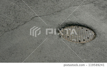 Manhole for collecting rainwater on the road. Manhole for collecting rainwater on the road. 119589241