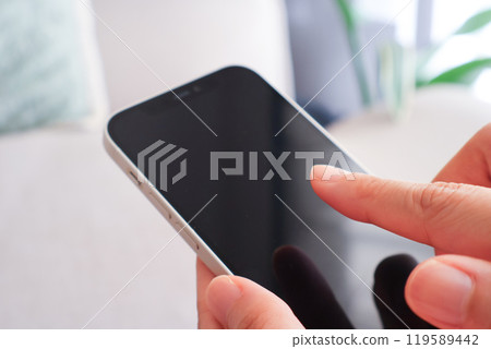 Women's hand with smartphone Women's hand with smartphone 119589442