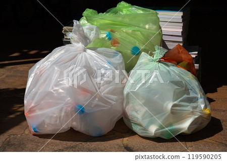 Plastic Waste Bags with Recyclable Items 119590205