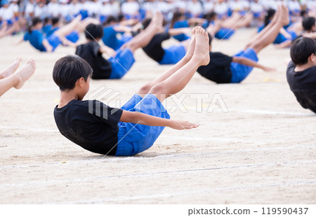 Elementary school boys doing group gymnastics at a sports day Elementary school boys doing group gymnastics at a sports day 119590437