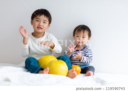 Boy holding fruit 119590743
