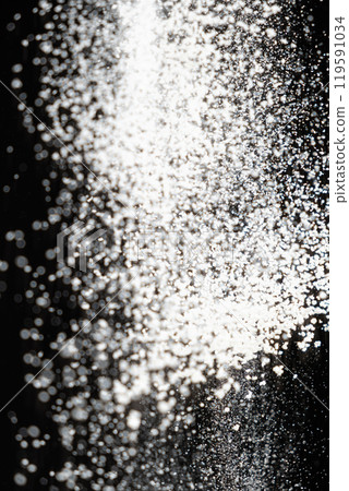 Abstract black and white background of pouring flour, space for text Abstract black and white background of pouring flour, space for text 119591034