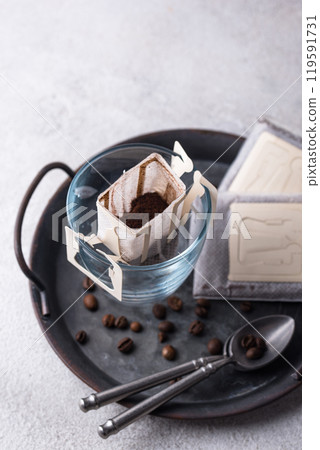 Freshly brewed drip coffee in glass cup Freshly brewed drip coffee in glass cup 119591731