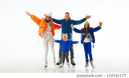 Family spread their arms wide, embracing fun of family time on ice, highlighting their playful spirit against white studio background. Family spread their arms wide, embracing fun of family time on ice, highlighting their playful spirit against white studio background. 119593177